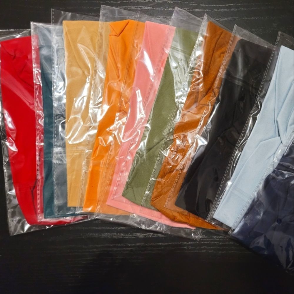NIB Set of 10 cloth headbands - variety of colors. All brand new in bag.